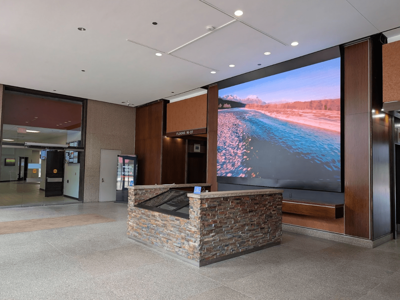 Elegant lobby of Scala Tower featuring contemporary furnishings and a welcoming atmosphere.