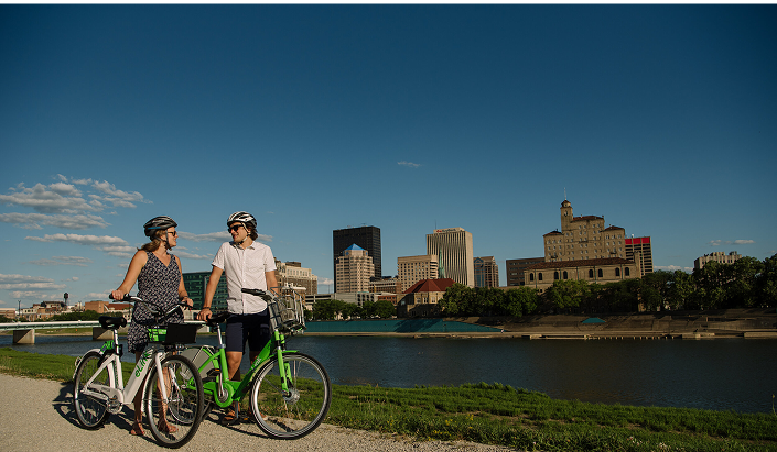Downtown Dayton investment exceeding $600 million, featuring Fifth Third Field, RiverScape MetroPark, Schuster Center, and CareSource headquarters, with new construction and historic building renovations.